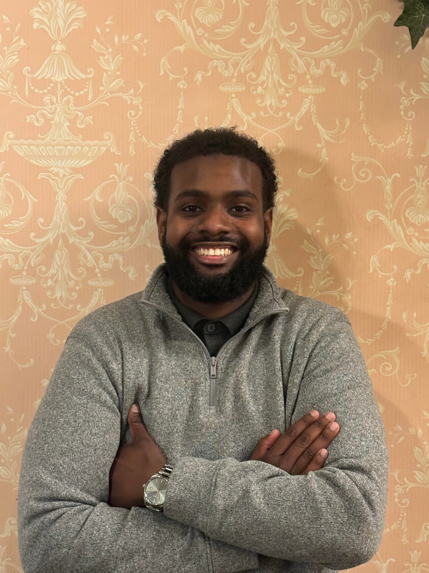 Elwaleed Gadalla smiling with arms crossed